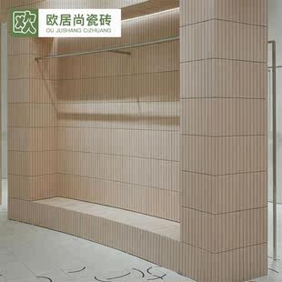 陶土色长条弧形马赛克卫生间暖色哑光釉面砖圆柱子背景墙面小条砖